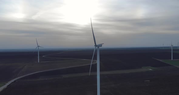 Aerial View on Wind Turbine Renewable Energy Production Farm at Dawn alt