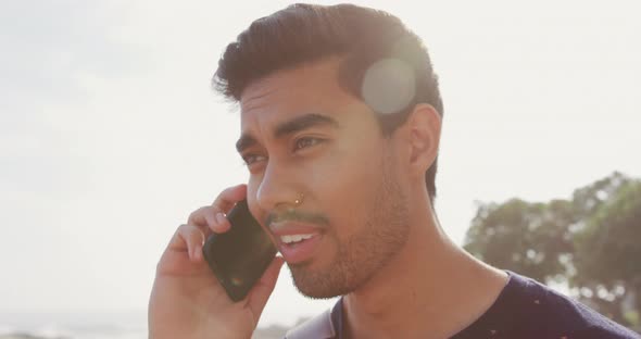 Young man talking on the phone alt