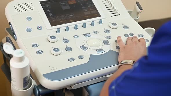 The Doctor Makes an Ultrasound To the Patient and Examines the Organs on the Monitor