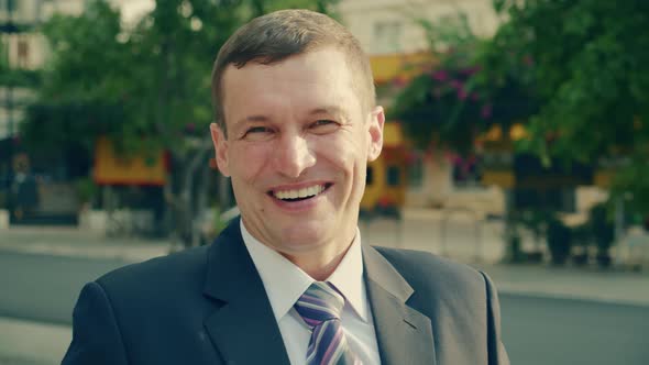 Portrait Business Man of Cheerful Male Boss Looking at Camera and Smiling alt