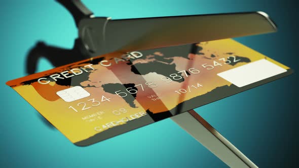 Slow motion animation of a credit card being cut by a pair of scissors. HD alt