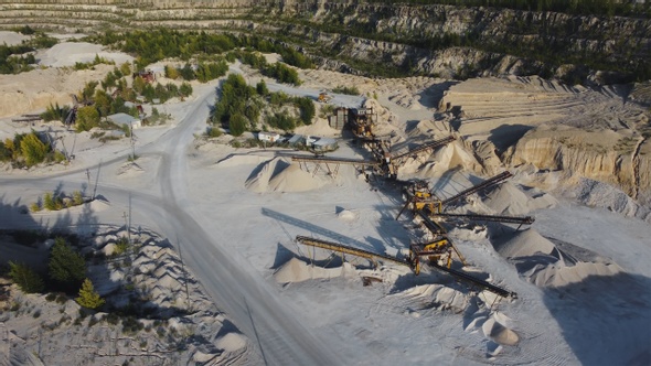 Aerial view opencast mining limestone quarry.