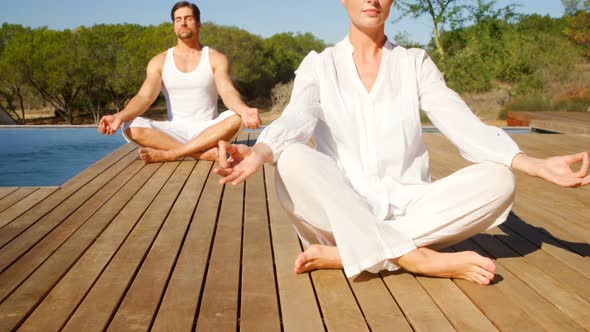 Couple doing meditation at safari vacation 4k alt