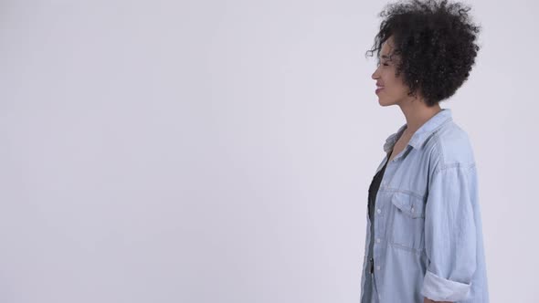 Profile View of Happy Young Beautiful African Woman Smiling alt