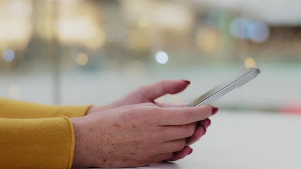 Closeup Female Hands Mature Caucasian Unrecognizable Woman Typing on Phone Middle Aged Businesswoman alt
