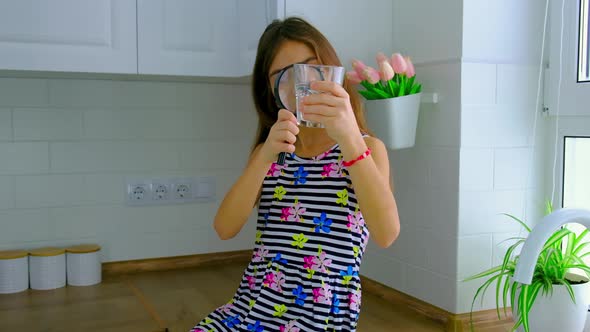 The Child Examines the Water with a Magnifying Glass alt