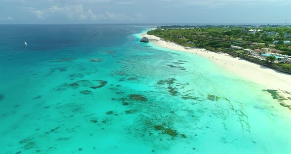 Aerial view of beautiful blue sea and sandy beach at sunny day