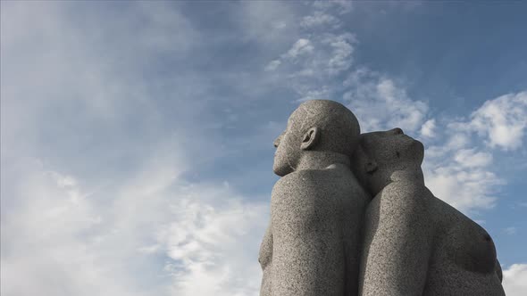 Granite Sculpture Of A Man And Woman Sitting Back to Back At Vigeland Park In Frogner Park, Oslo, No alt