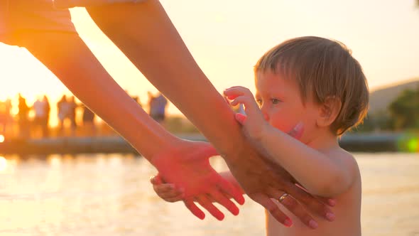 Concept of Love Family Trust. Close Up of Kid Giving Hand To Mother. Hands of Mother and Baby