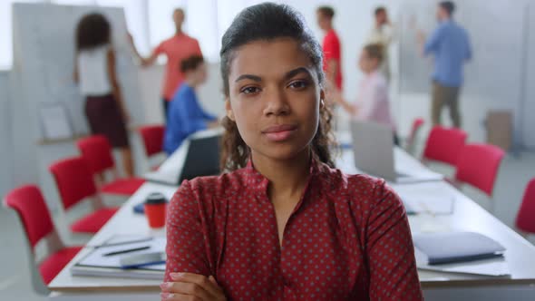 Serious Afro Woman Posing Camera Office alt