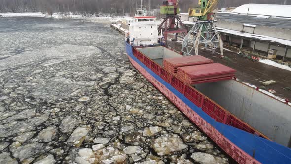 Cargo ship in port alt
