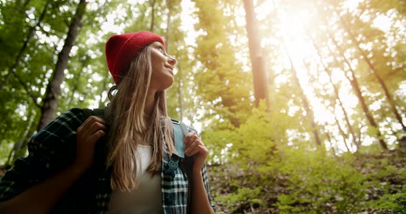 Woman Looking Up on Trees in Forest Backpack