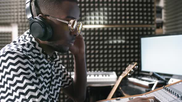 Black Male Audio Engineer Mixing Music alt