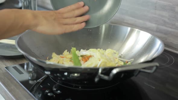 Adding Vegetables to the Wok