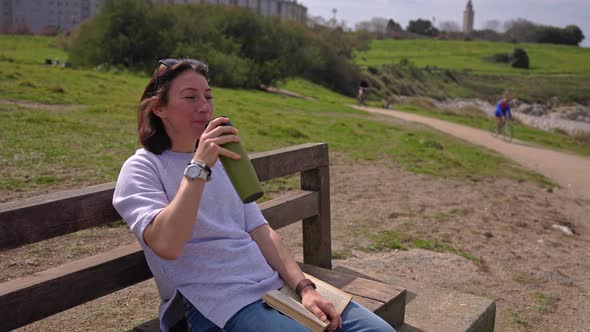A Girl By the Ocean Drinks Tea alt