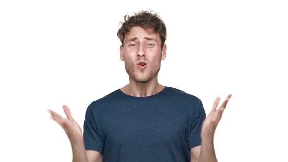 Portrait of Caucasian Man in Tshirt Gesturing and Yelling with Annoyance Isolated Over White alt