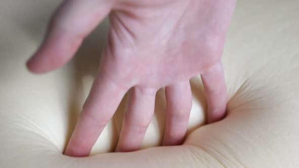 Touching a memory foam bed alt