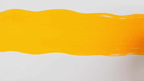 Abstract Brushstrokes of Yellow Paint Brush Applied Isolated on a White Background alt