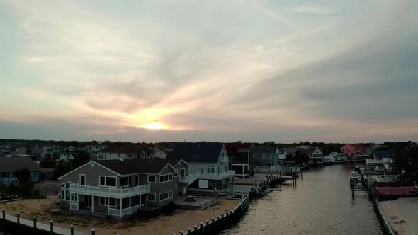Aerial Drone View of Local Residential Suburb of River in View of Distant Toms River alt