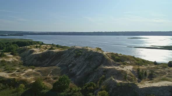 Aerial Drone Footage. Fly Over Sand Island with Cross on Top Hill alt