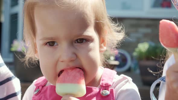 Close Up Portrait Little Toddler Girl Enjoys Delicious Ice Cream Cone