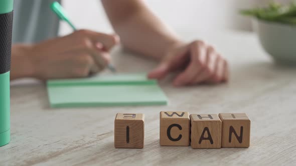 The Girl Crosses A Few Items Off The List And Clenches Her Fists Happily. Excited Joyful Gesture alt