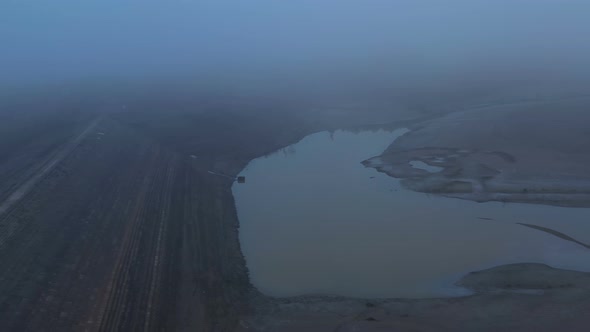 Flight Over A Dry Dam In The Autumn Foggy Day In The Late Afternoon 1 alt