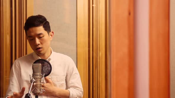 Singer performing in studio alt