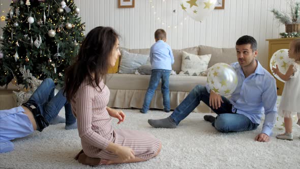 Large Family with Three Children is Having Fun at Home in Christmas Eve