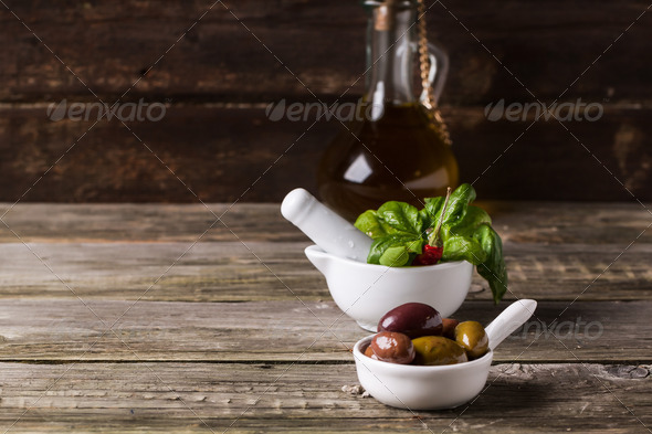 Olives with olive oil and basil - Stock Photo - Images