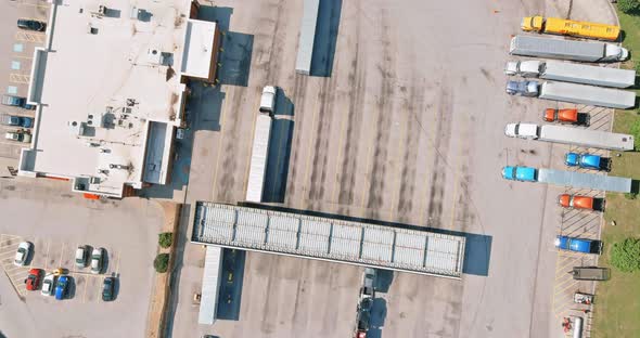 Top View Car Parking for Heavy Trucks Stop on Rest Area in the Highway Trucks Stand in a Row alt