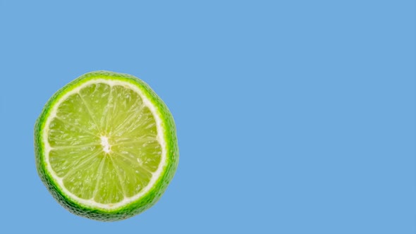 Animation of a Lime Jumping or Hitting the Edges of the Screen on a Blue Background