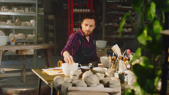Young Man Is Working In Ceramics Studio