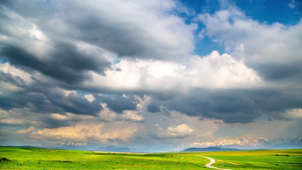 Colorful Clouds Over a Mountain Valley in Spring
