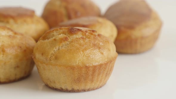 Cornbread baked and arranged on plate slow tilt 4K 2160p 30fps UltraHD footage - Muffin cornmeal clo alt