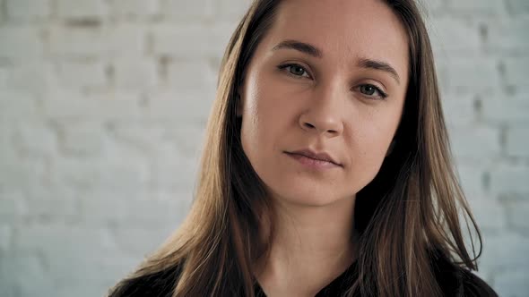 Girl Raises His Head Opens Beautiful Green Eyes and Smile alt