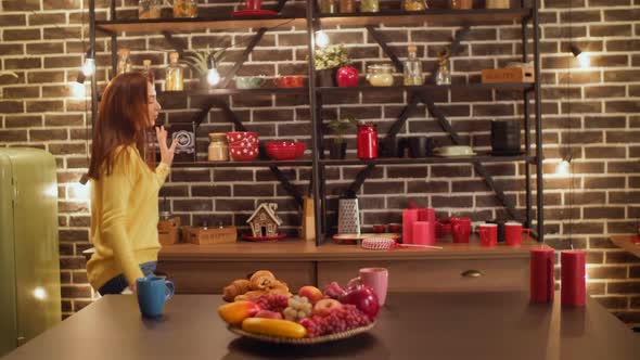 Joyful Woman Dancing Doing Housework in Kitchen alt