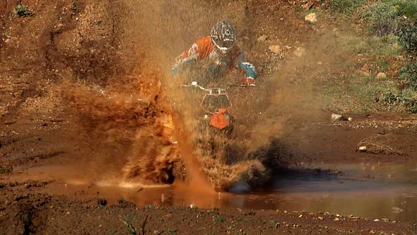 Biker Splashing Mud alt