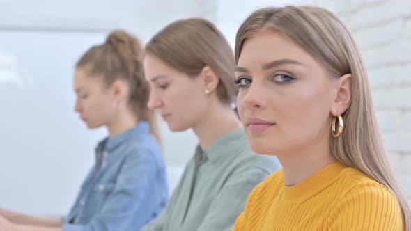 Portrait of Young Creative Designer Smiling at the Camera alt