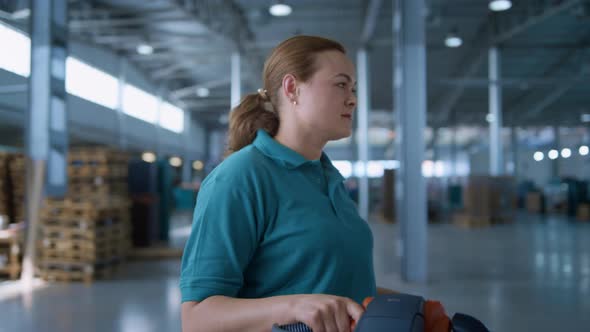 Female Storehouse Vehicle Operator Transporting Shipment Pallets Working Process alt