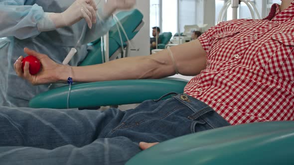 Nurse Taking Venous Blood of Patient alt