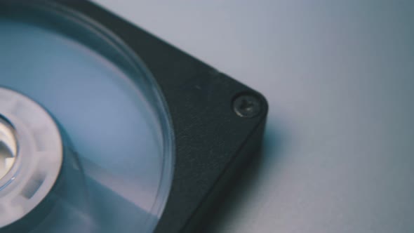 Vintage Compact Cassette with Tape on White Background alt