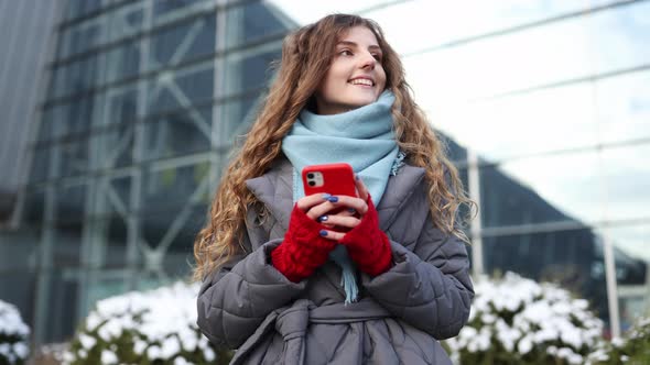 Portrait of Happy Beautiful Curly Woman Use Mobile Phone Texting Messages