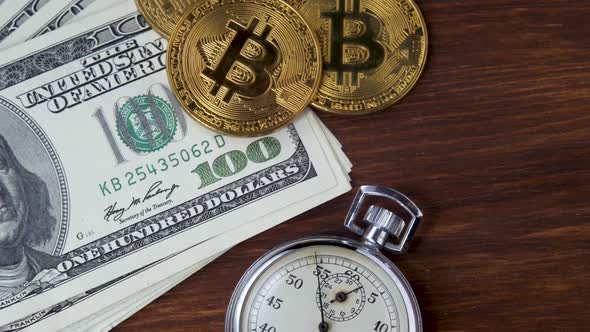 Bitcoin BTC with Stopwatch Lies on Dollars Bills