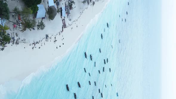 Vertical Video of the Ocean Near the Coast of Zanzibar Tanzania Aerial View alt