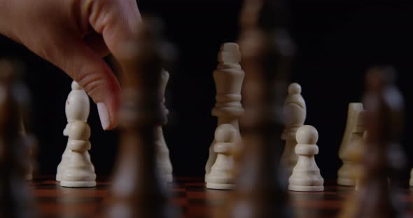Hand Moving A Pawn Piece On A Chessboard 20b