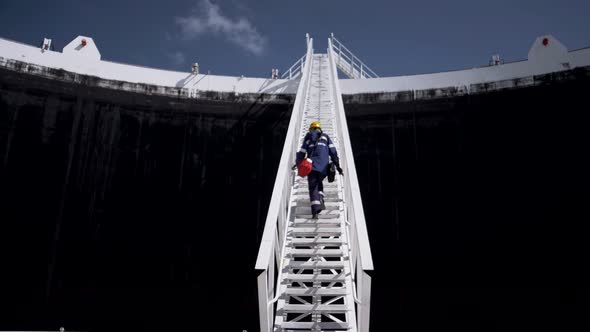 Energy industry on the roof of a huge oil storage tank