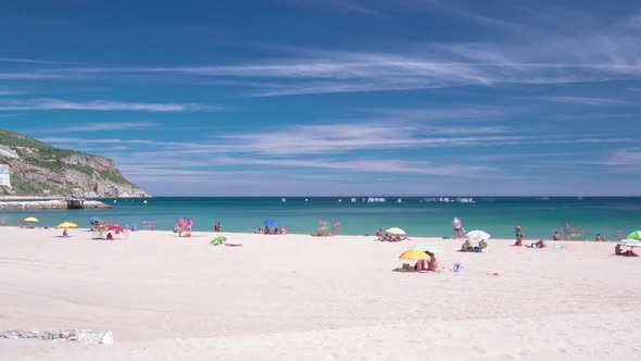 Beach in Sesimbra with Moving Clouds Portugal Timelapse alt