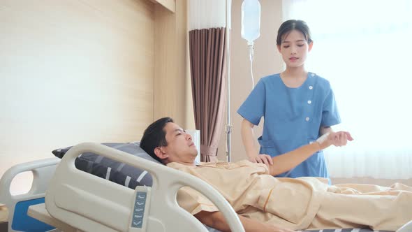 Asian female Physiotherapist working with patient in clinic alt