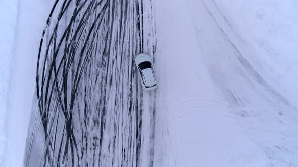 Aerial View of The Rally Car on A Snowy Road alt